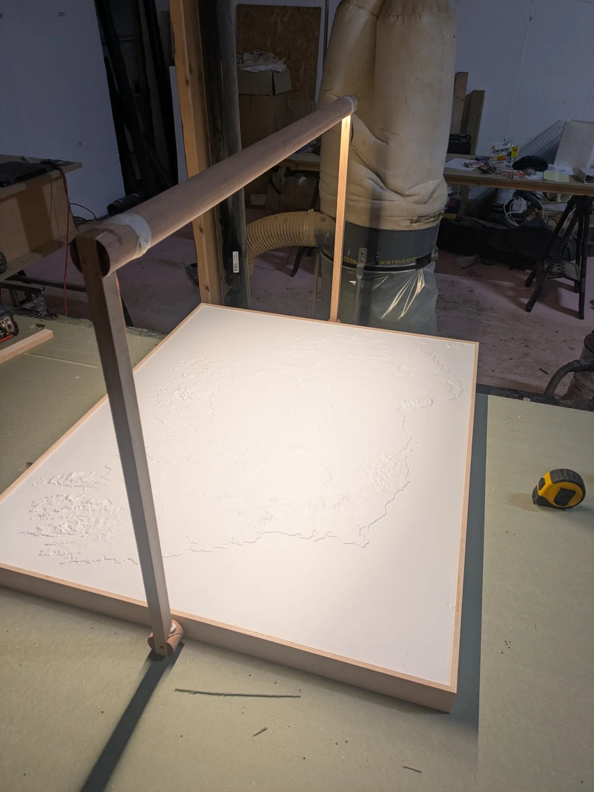The rotating light arm positioned above the terrain model during testing
