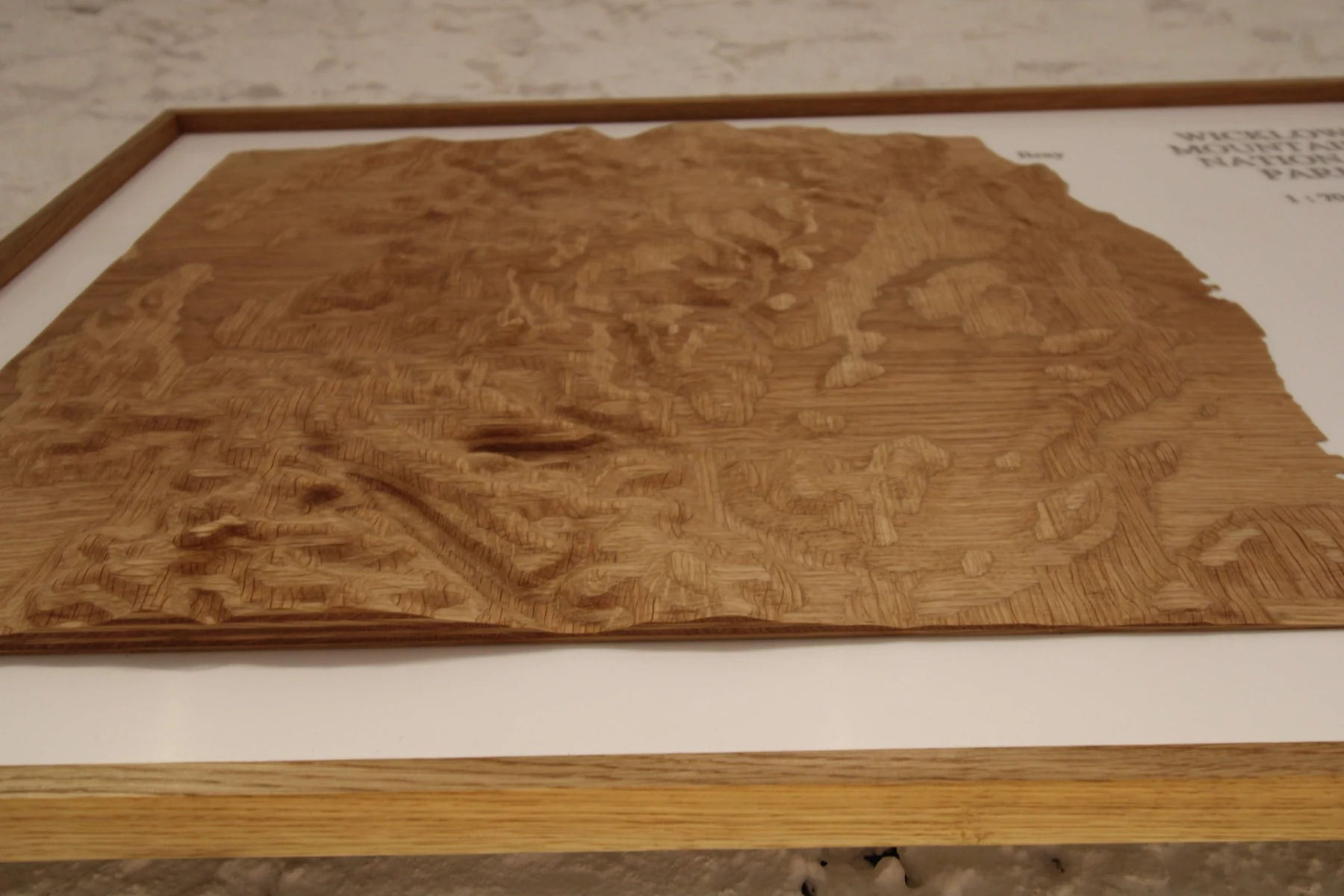 Low angle view of the subtle elevation lines machined through thick oak veneers