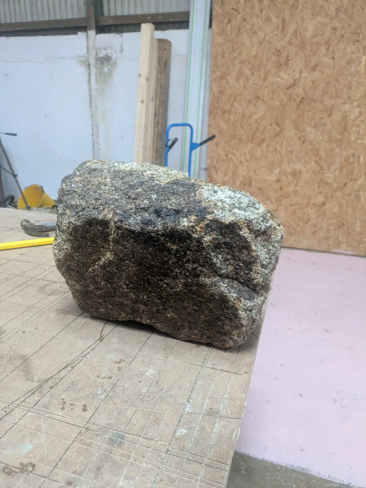 A granite stone on the workbench during cleaning