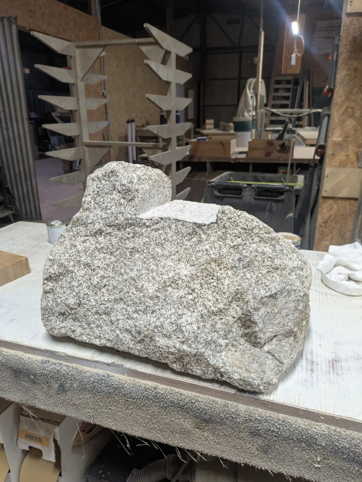 A granite stone with a broad notch cut into its top