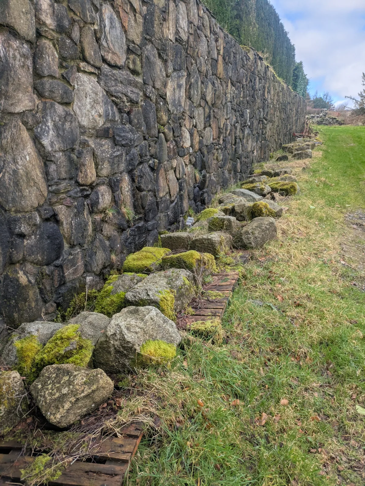 Granite stones beside an old stone wall
